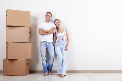 Local removal team planning a move in Brompton with packed boxes