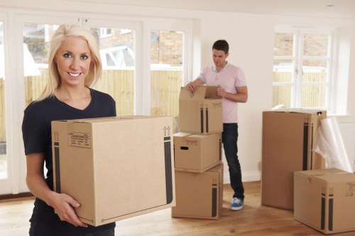 Trained movers handling furniture with care during relocation