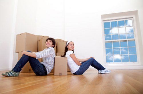 Packed boxes and furniture ready for a home relocation in Brompton