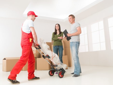 Professional movers handling access and loading in Brompton