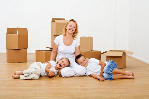 Carefully labelled moving boxes in a Brompton property with narrow access