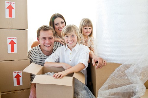 Packing and loading household items for house removals in Brompton