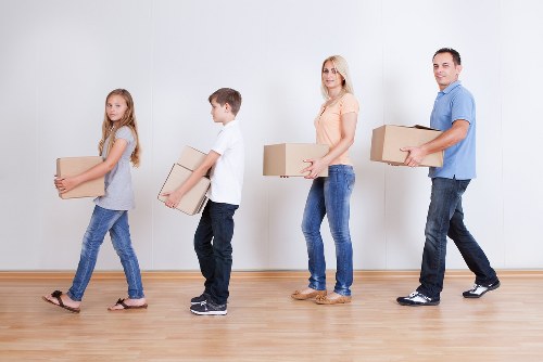 Professional movers handling furniture carefully during relocation